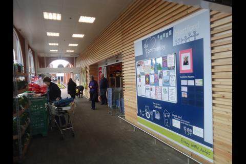 Wood cladding at the entrance provides the design theme for the interior.
